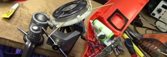Vacuum cleaner repair parts and tools on a workbench in Evansville, IN